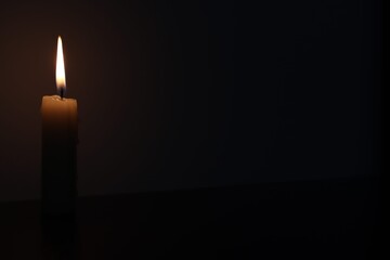 Candle black background of mourning funeral moment of silence	