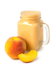 Peach smoothie of fresh peach and yogurt in a glass jar isolated on a white background