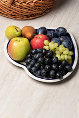 fruit plate top view. Glucose and vitamins in seasonal fruits