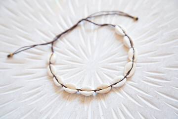 White shell choker necklace on white background