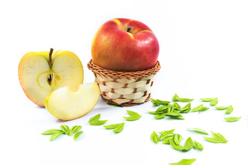 Beautiful red apple and a slice, composition on a white isolated background on the theme of harvest
