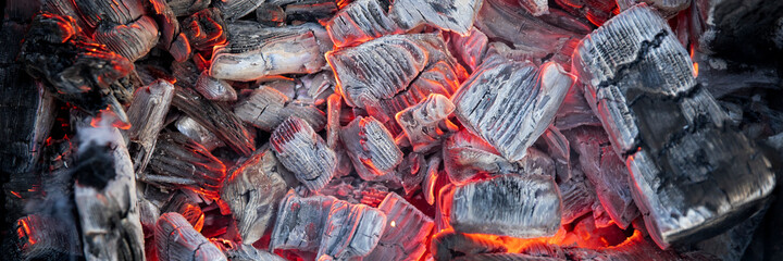 Hot coals are burning. Sparks from fire.