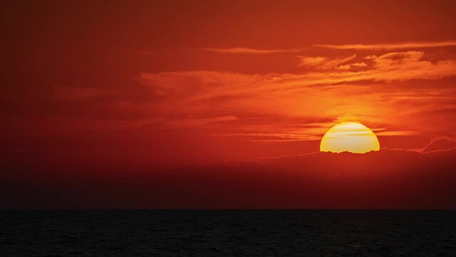 Amazing colourful time lapse sunset at ocean near