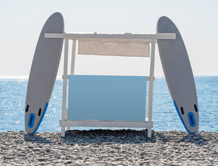SUP rental station with blank advertising billboard on beach