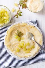 Crepes with grapes and pastry cream