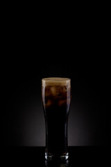 Studio shot of a glass of sparkling pop soda drink.