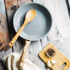 Rustic Setting of Fry Pan, Spoon & Herbs