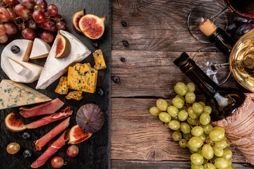 Wine and cheese still life, Food recipe background. top view