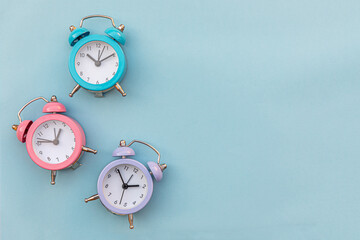 Simply minimal design three ringing twin bell classic alarm clock Isolated on blue pastel...