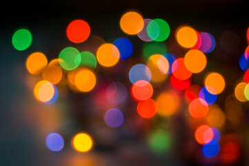 Festive Christmas lights, blurred background for the new year and your holiday. Celebrating the new year or birthday