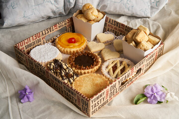 Sweet breakfast basket on a bed