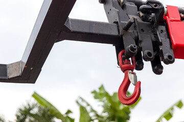 Hook construction crane with slings .