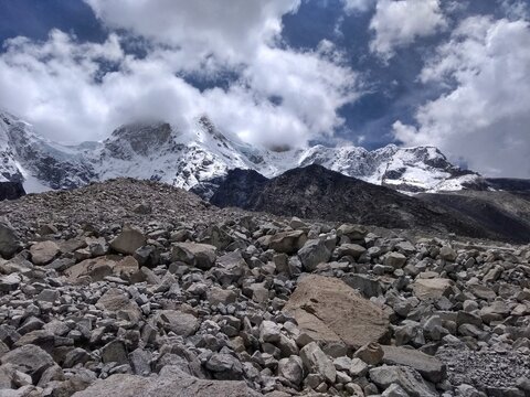 Snow peaked mountain at Laguna Paron, Huaraz, Peru. A blue-green lake on the Peruvian Andes. At 4185 meters above sea level, it's surrounded by snowy peaks and a pyramid mountain. 