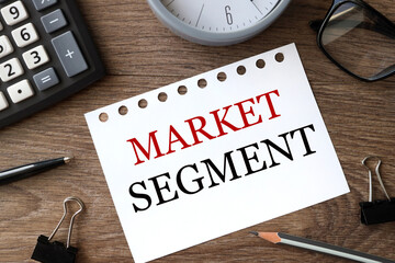 market segment, text on white paper on wood background
