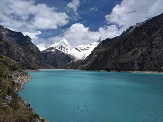Fototapeta na wymiar Laguna Paron, Huaraz, Peru. A blue-green lake in the Cordillera Blanca on the Peruvian Andes. At 4185 meters above sea level, it's surrounded by snowy peaks and a pyramid mountain. 
