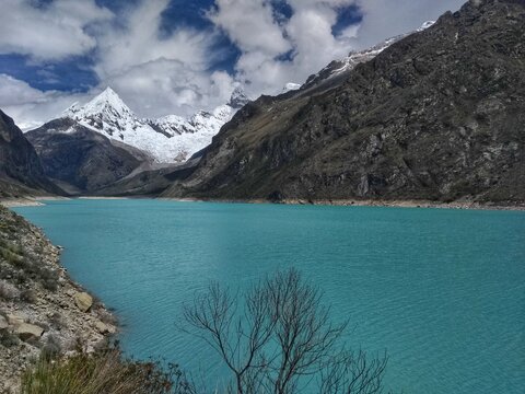 Laguna Paron, Huaraz, Peru. A blue-green lake in the Cordillera Blanca on the Peruvian Andes. At 4185 meters above sea level, it's surrounded by snowy peaks and a pyramid mountain. 