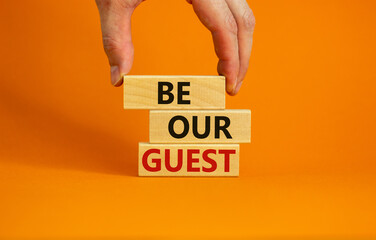 Male hand placing a block with word 'be' on top of blocks with words 'be our guest'. Beautiful...