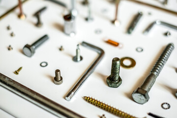 Screws and washers on white background