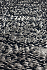 Textures made by water and wind on the sand at the beach