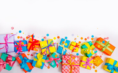Fototapeta na wymiar colorful boxes and confetti on a white isolated background
