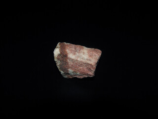 red aventurine, a type of quartzite on a black background