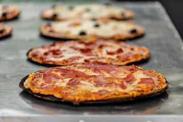 fresh pizza in market in Provence, France.