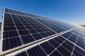 Obraz premium Aerial view of Solar panel, photovoltaic, alternative electricity source - concept of sustainable resources on a sunny day