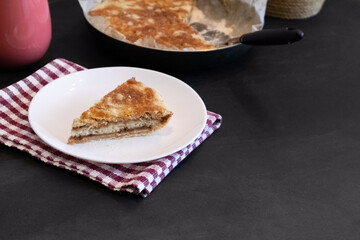 Homemade apple pies on dark background. Autumn dessert.