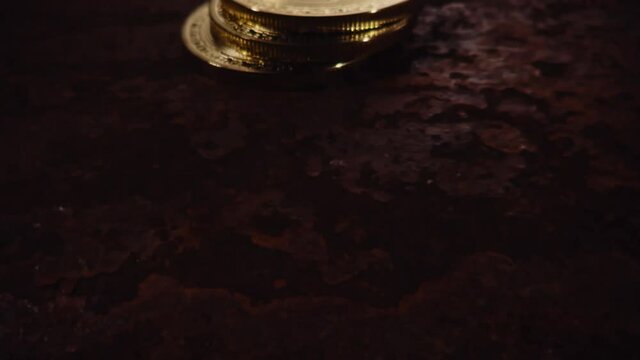 Move across Bitcoins against a rust background.
