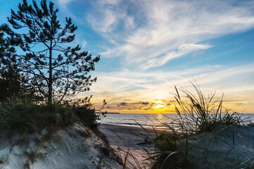 Sunset over the sea. Reflection of sunlight in the sea waves. The sky in the sunset rays. Russia Baltic Sea. © SeagullNady