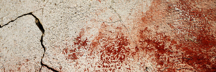 Concrete wall texture with cracked plaster. Weathered rough surface. Panoramic background for grunge design.