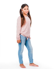 Happy cute smiling casual girl 8-10 years old standing against white background, pink long-sleeve blouse and blue jeans; Hispanic, long brown hair; full-length