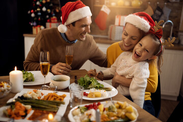 Joyful family enjoying at dining table on Christmas day.