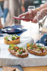 Crostini with Tuna Pate and Fresh Tomatoes. Brunch in Restaurant