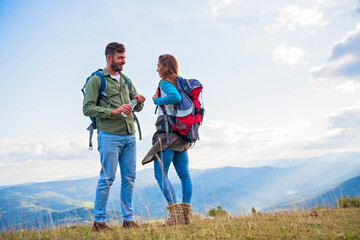 Young couple taking a break on a hike.