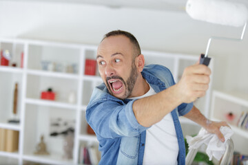 Fototapeta premium an angry man while painting