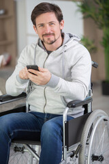 disabled man of middle age using his phone