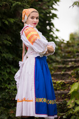 Beautiful woman wearing traditional Eastern Europe folk costumes. 
Slovak folklore.