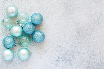 Christmas blue balls (decorations for the Christmas tree, toys) on a blue background. Festive mood, new year.