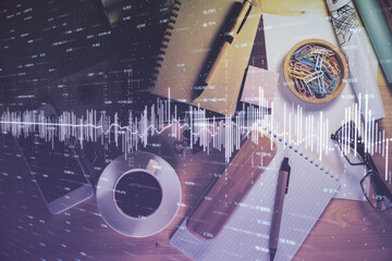 Double exposure of forex graph drawing and work table top veiw. Concept of financial analysis.