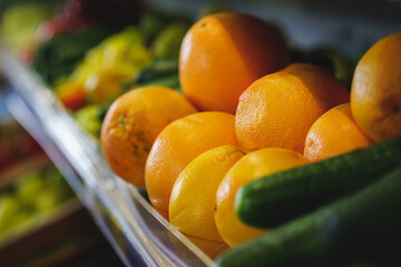 Bright orange ripe oranges on the counter in the supermarket.