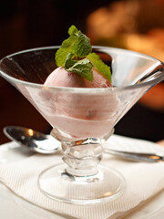 ICE CREAM IN A PLATE IS DELICIOUS WITH A MINT PETAL