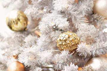 Fototapeta na wymiar Balls on fir branches, pines, lights background; festive Christmas and New Year celebration card, selective focus, shallow DOF, toned
