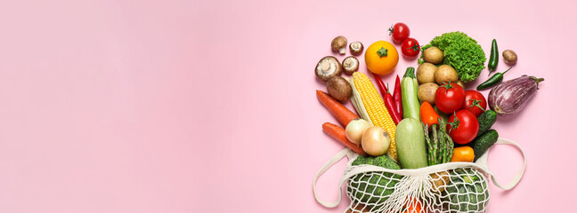 Many fresh different vegetables on pale pink background, top view with space for text. Banner design