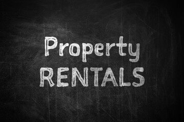 Obraz premium Text Property Rentals written on black chalkboard