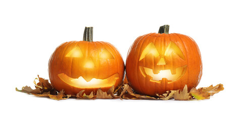 Cute pumpkin jack o'lanterns and autumn leaves on white background. Halloween decor