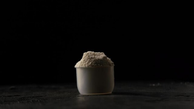 Protein powder in scoop, close up