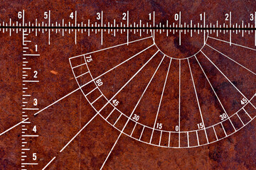 Protractor and ruler on masonite board 