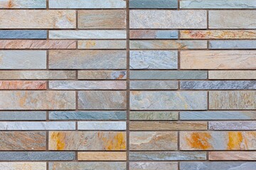 Block pattern brown stone cladding wall tile texture and seamless background