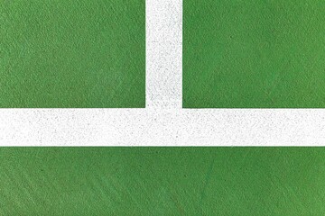A close up of white lines on the tennis court floor